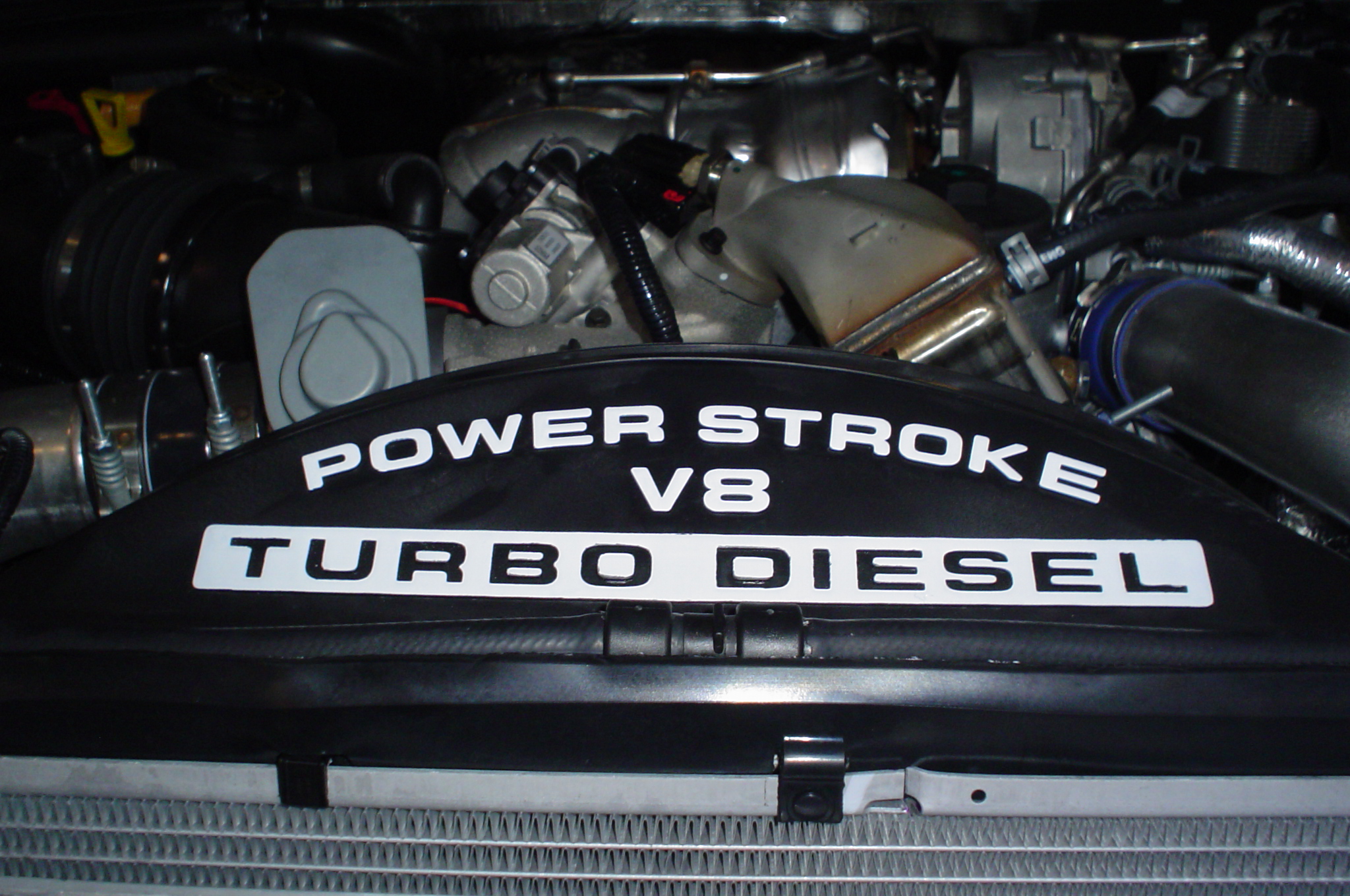 Real 6.4L Powerstroke V8 turbo-diesel engine displayed in a Ford Super Duty
